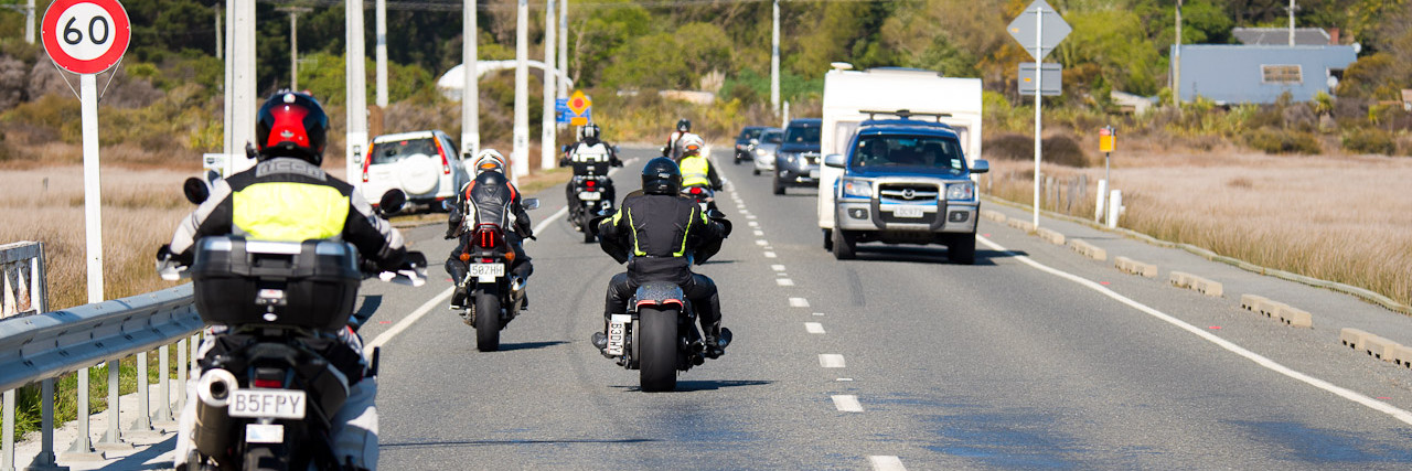 View of motorcyclists riding in front of camera