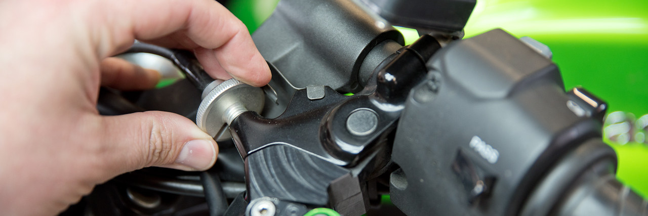 Close up of person adjusting bike