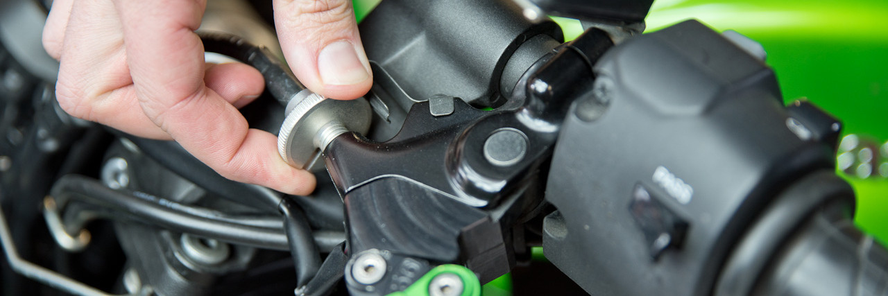 Close up of person adjusting bike