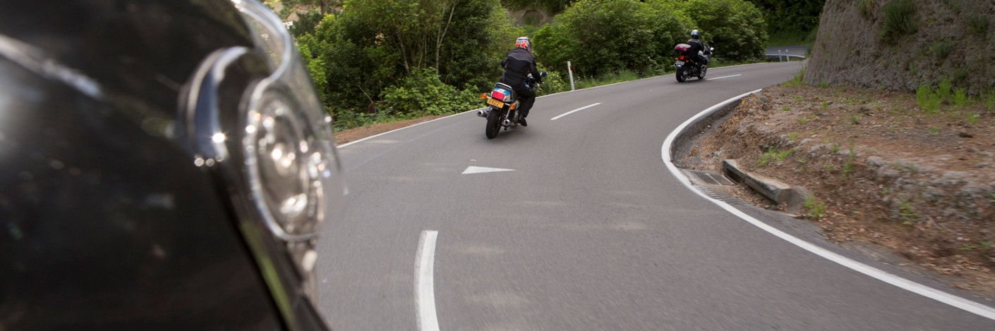 View of motorcyclists riding in front of camera