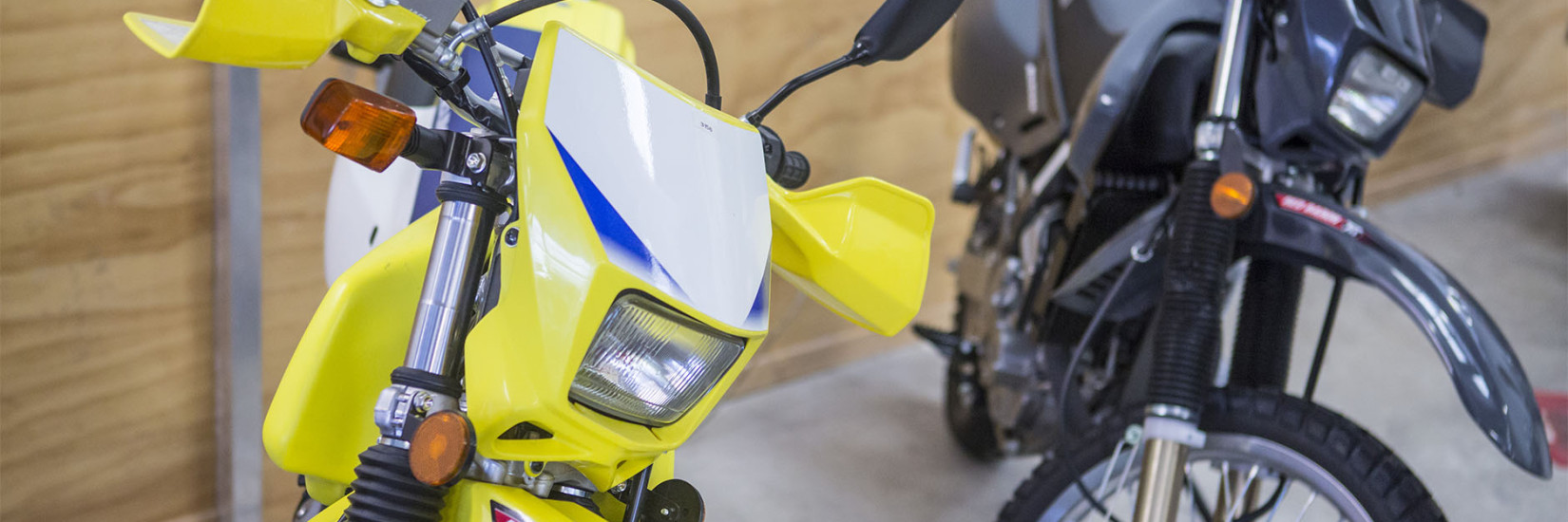 Two bikes next to each other in storage