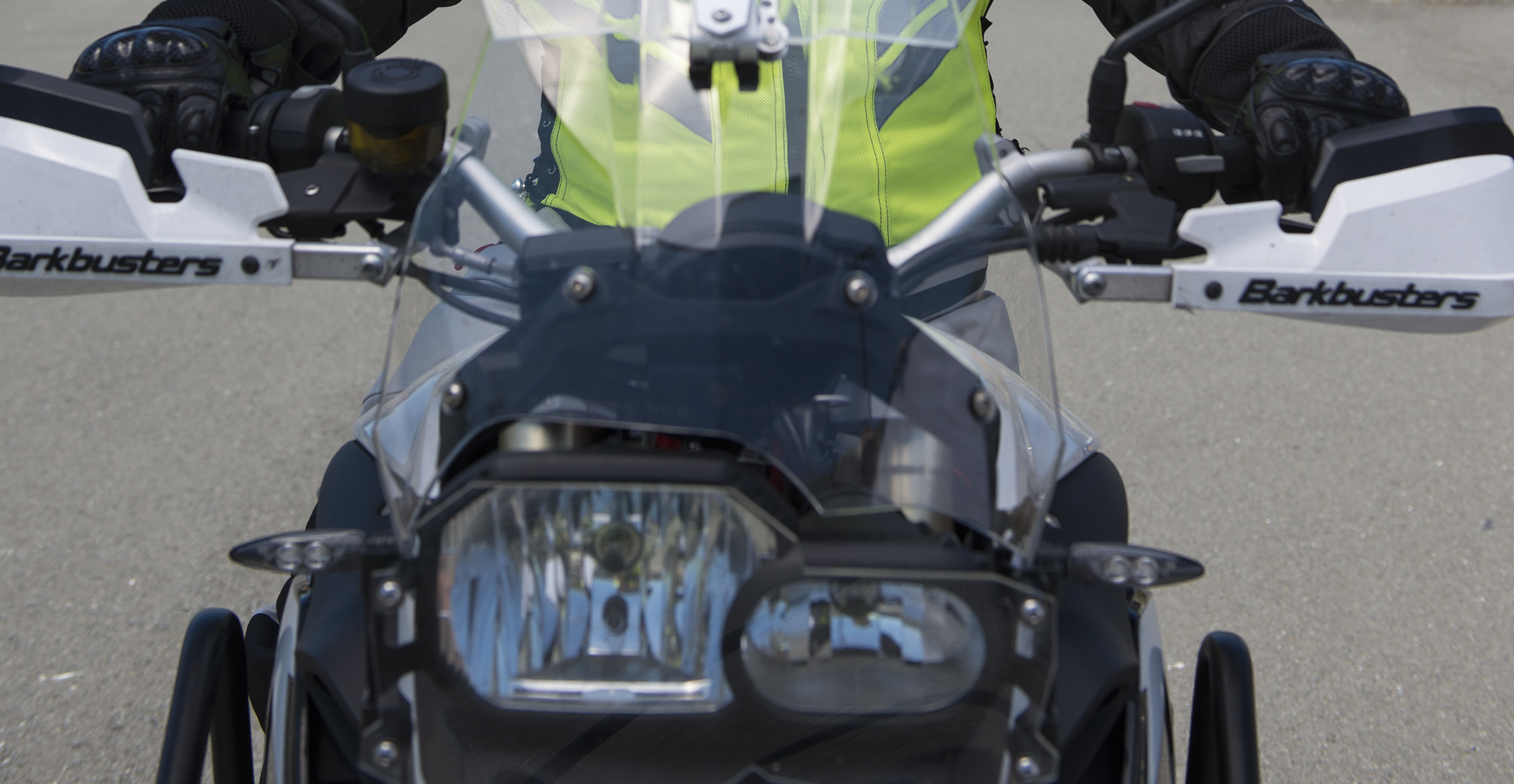 Close up of the front of a dual purpose/adventure bike with rider