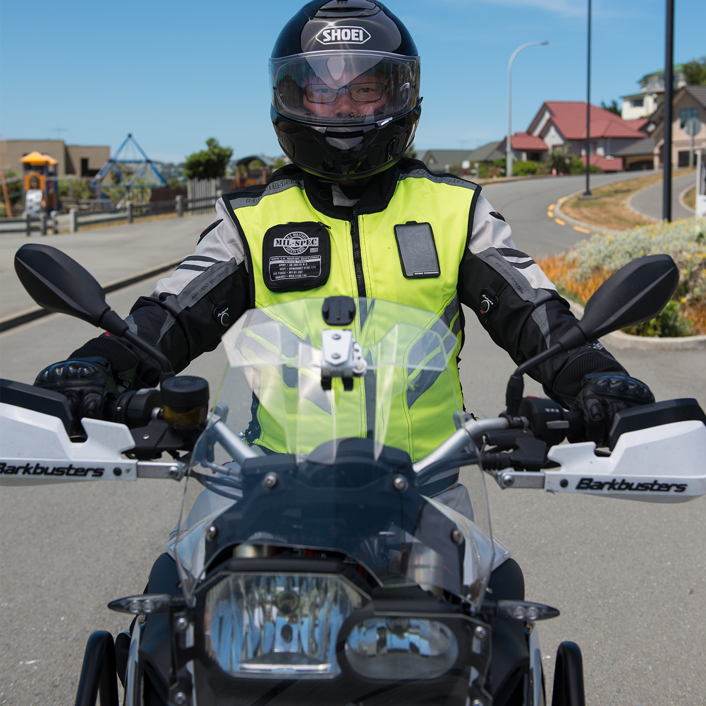 Close up of the front of a dual purpose/adventure bike with rider