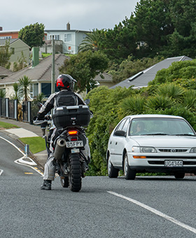 Bike waiting to turn right with oncoming traffic