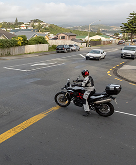 Bike waiting to turn right into main flow of traffic