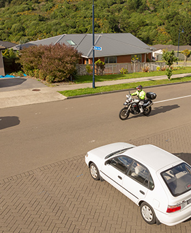 Bike riding with traffic waiting to turn